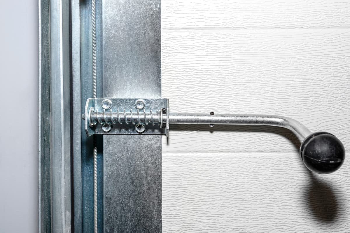 Manual locks on overhead doors with automatic openers