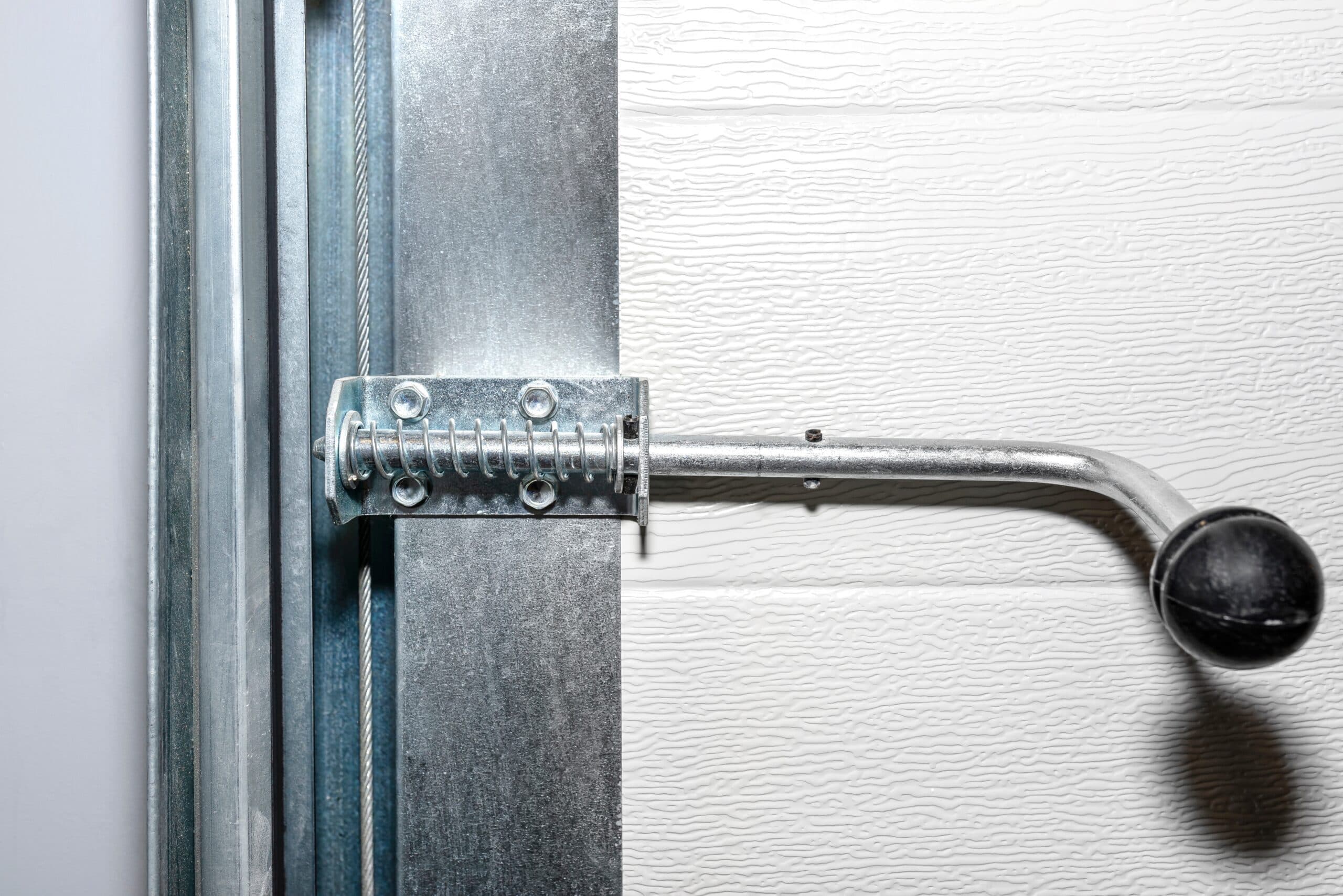 Manual locks on overhead doors with automatic openers